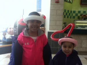 Two young ladies at the West Towne Mall wearing simple balloon hats