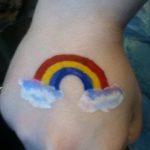 Hand painting of rainbow with clouds