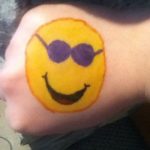 Hand painting - smiley face with sun glasses