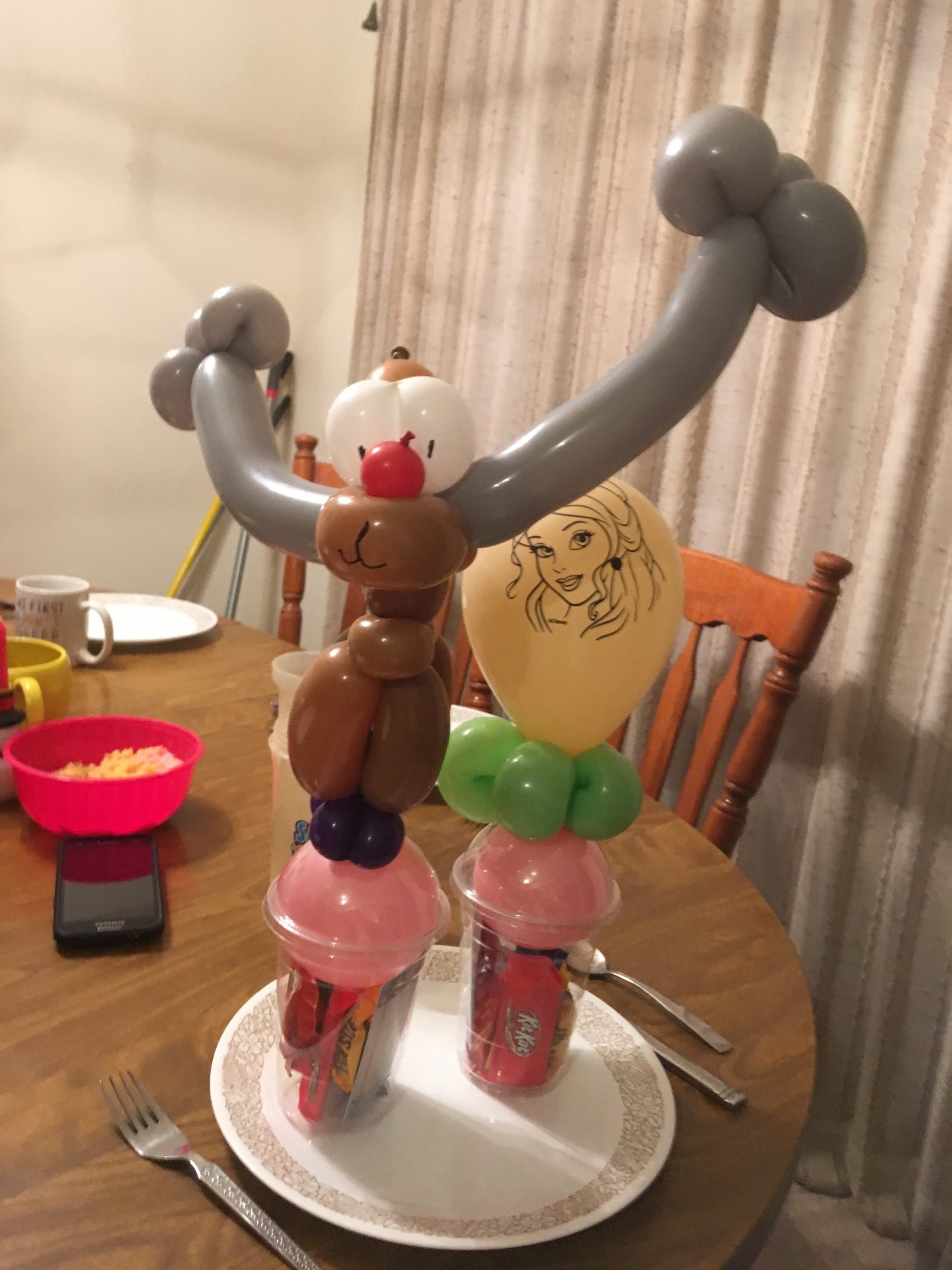 Balloon deer and princess candy cup (twisted balloons aren't safe for children under 3 years old, so the Princess balloon for the younger sister)