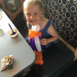 Young lady with a purple penguin