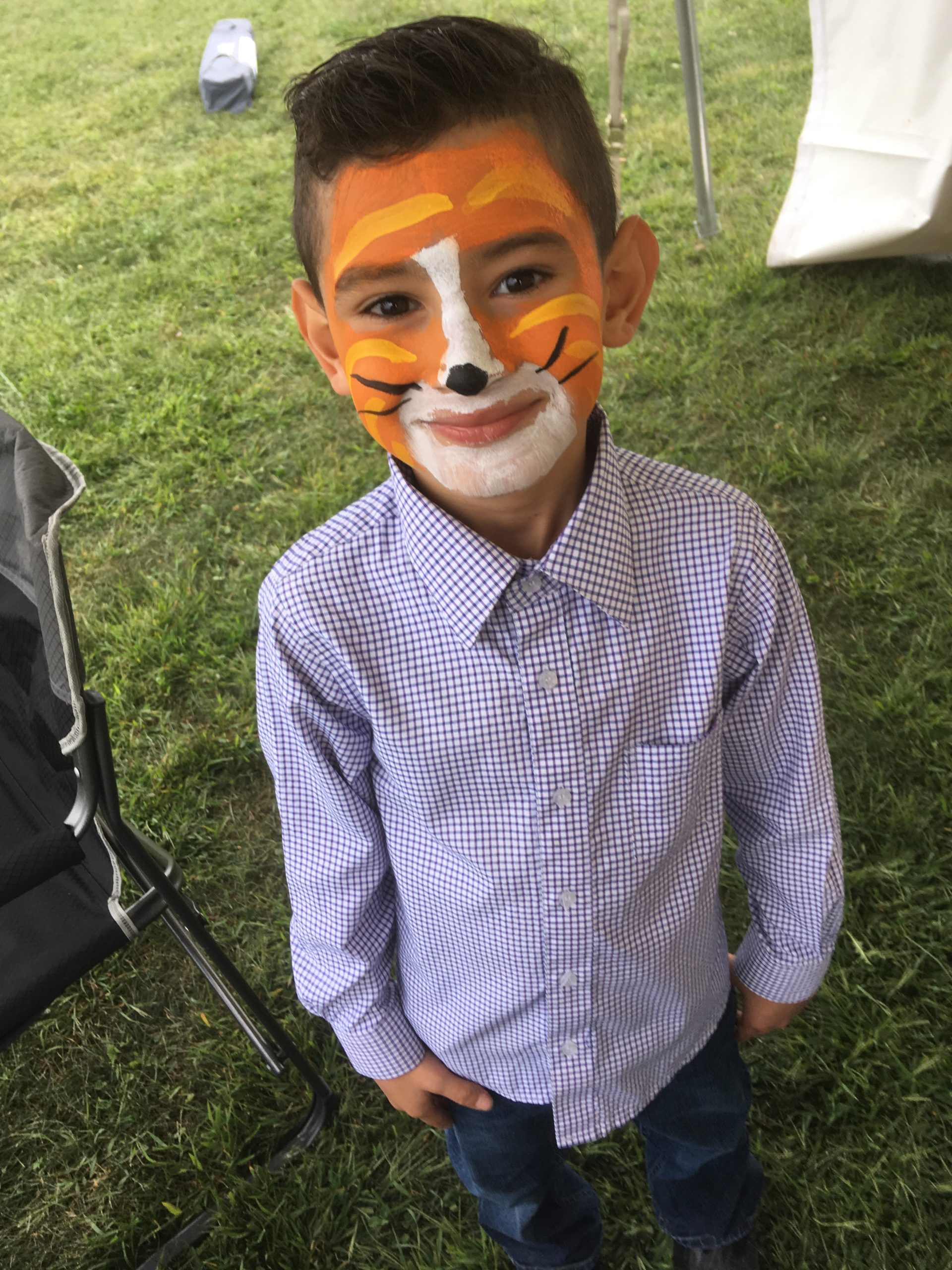Young man with tiger face paint at Los Dells 2019