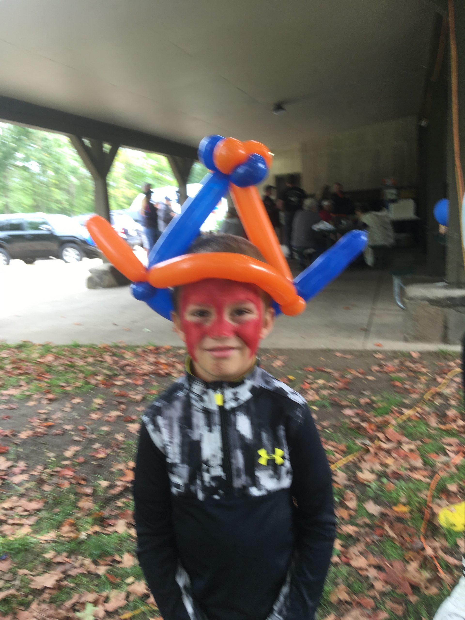 Flashy superhero with a balloon hat
