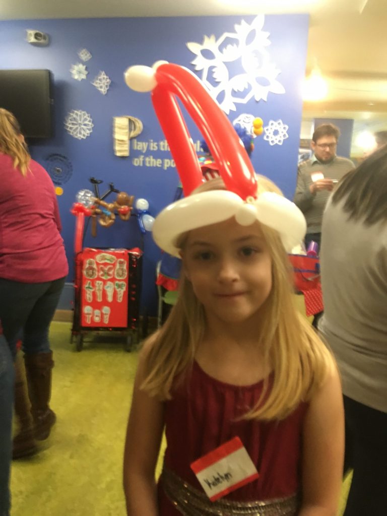 And her sister with a matching Santa hat