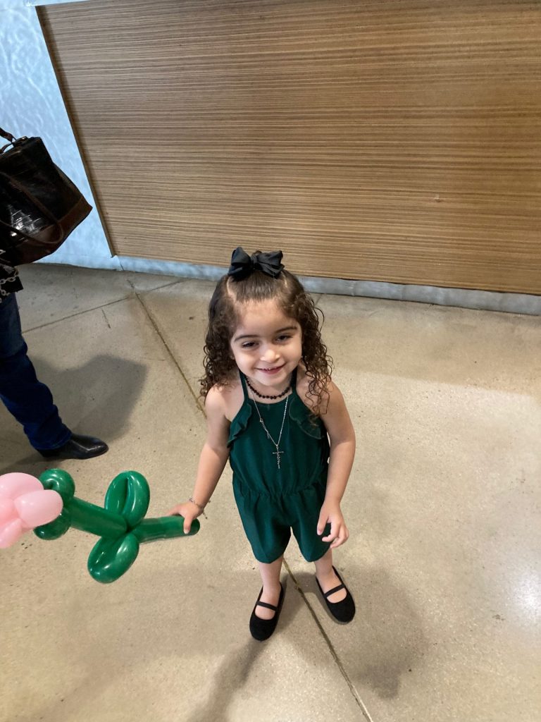 Happy young girl with balloon flower at the Spring Jamboree 2022 day 2at Central Church
