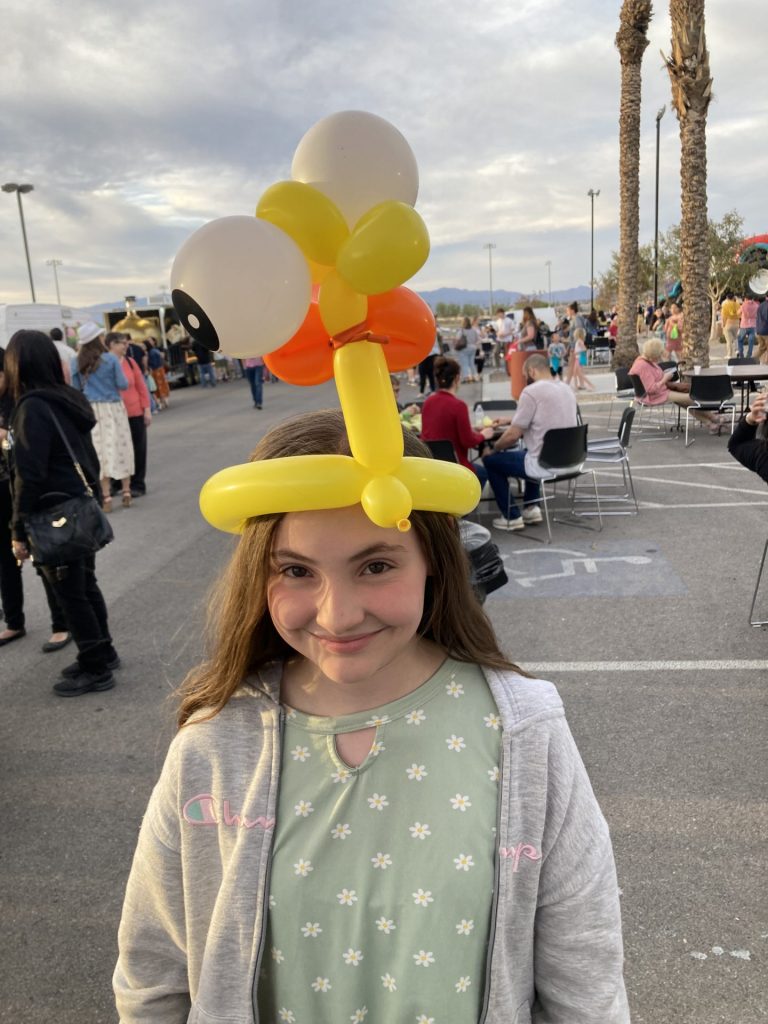 Young lady with a duck hat (on backwards) at Easter at Central on Saturday