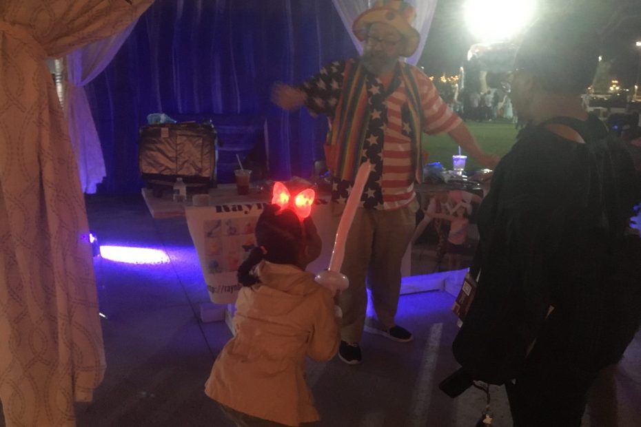 Raynbow and a young lady with a balloon sword